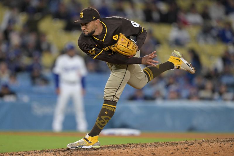 Apr 14, 2024; Los Angeles, California, USA; San Diego Padres pitcher Robert Suarez (75) earns a save in the ninth inning against the Los Angeles Dodgers at Dodger Stadium. Mandatory Credit: Jayne Kamin-Oncea-USA TODAY Sports