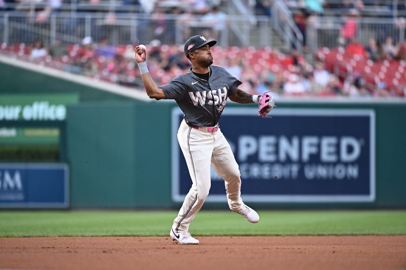 Aug 10, 2024; Washington, District of Columbia, USA;  Washington Nationals shortstop Nasim Nunez (26) throws to first base during the first inning against the Los Angeles Angels at Nationals Park. Mandatory Credit: James A. Pittman-USA TODAY Sports