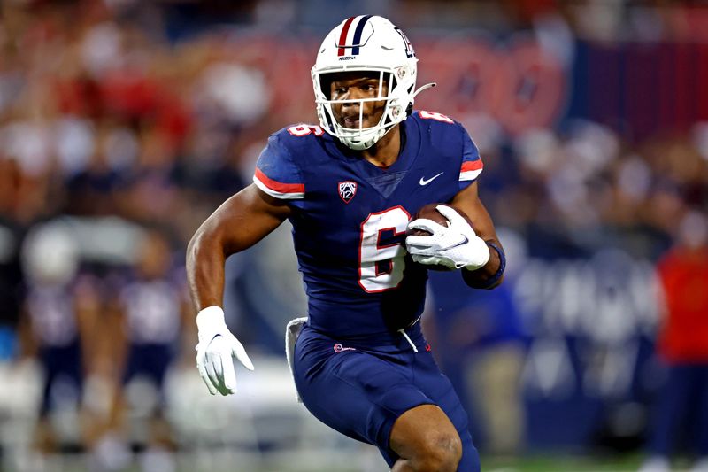 Oct 8, 2022; Tucson, Arizona, USA; Arizona Wildcats running back Michael Wiley (6) runs the ball during the first half against the Oregon Ducks at Arizona Stadium. Mandatory Credit: Mark J. Rebilas-USA TODAY Sports