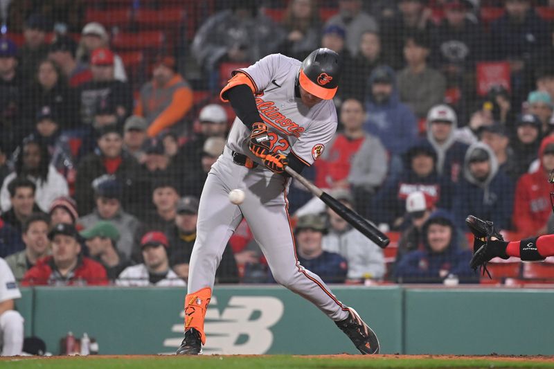 Apr 11, 20024; Boston, Massachusetts, USA; Baltimore Orioles designated hitter Ryan O'Hearn (32) hits a double during the tenth inning against the Boston Red Sox at Fenway Park. Mandatory Credit: Eric Canha-USA TODAY Sports