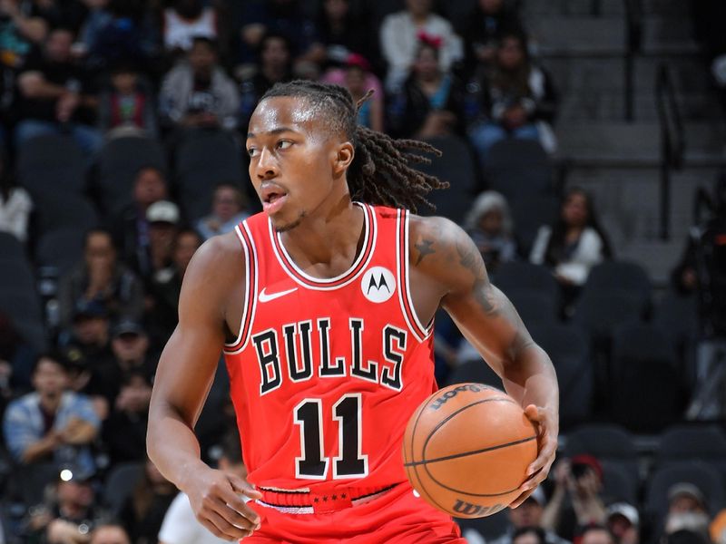 SAN ANTONIO, TX - DECEMBER 5: Ayo Dosunmu #11 of the Chicago Bulls dribbles the ball during the game against the San Antonio Spurs on December 5, 2024 at the Frost Bank Center in San Antonio, Texas. NOTE TO USER: User expressly acknowledges and agrees that, by downloading and or using this photograph, user is consenting to the terms and conditions of the Getty Images License Agreement. Mandatory Copyright Notice: Copyright 2024 NBAE (Photos by Michael Gonzales/NBAE via Getty Images)