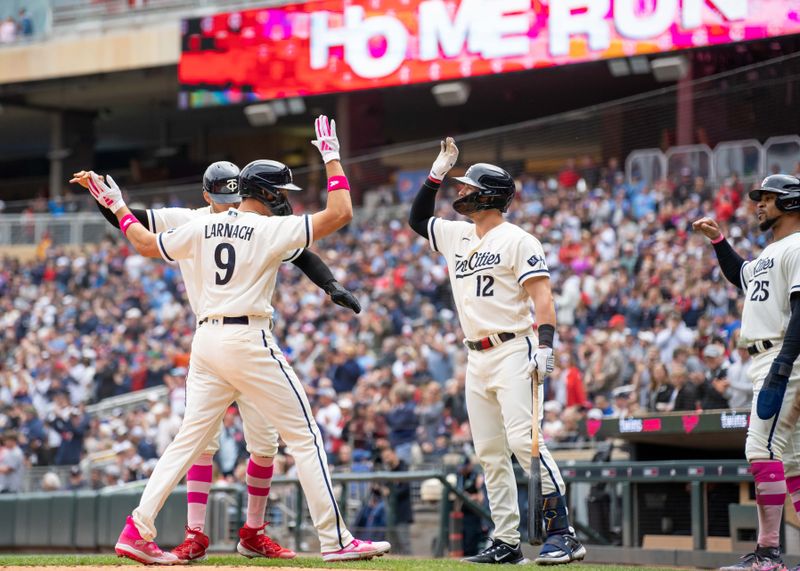 May 14, 2023; Minneapolis, Minnesota, USA; Minnesota Twins left fielder Trevor Larnach (9) is congratulated by teammates after hitting a home run off Chicago Cubs starting pitcher Marcus Stroman (0) at Target Field. Mandatory Credit: Matt Blewett-USA TODAY Sports