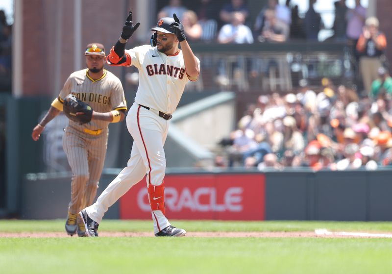 Jun 5, 2025; San Francisco, California, USA; San Francisco Giants first baseman Dominic Smith (7) gestures after hitting a single against the San Diego Padres during the second inning at Oracle Park. Mandatory Credit: Kelley L Cox-Imagn Images