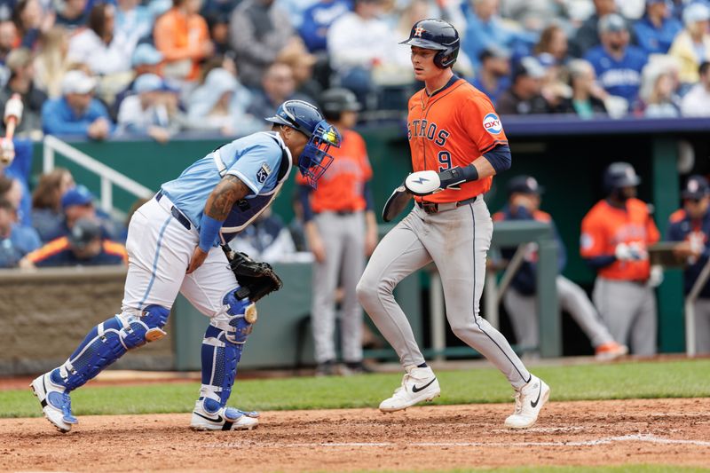 Apr 27, 2025; Kansas City, Missouri, USA; Houston Astros outfielder Zach Dezenzo (9) scores during the sixth inning against the Kansas City Royals  at Kauffman Stadium. Mandatory Credit: William Purnell-Imagn Images