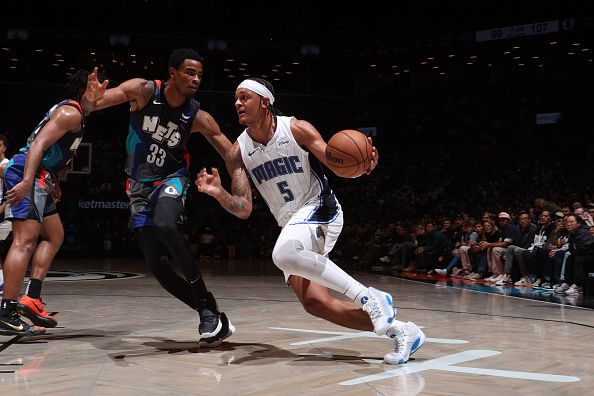 BROOKLYN, NY - DECEMBER 2: Paolo Banchero #5 of the Orlando Magic dribbles the ball during the game against the Brooklyn Nets on December 2, 2023 at Barclays Center in Brooklyn, New York. NOTE TO USER: User expressly acknowledges and agrees that, by downloading and or using this Photograph, user is consenting to the terms and conditions of the Getty Images License Agreement. Mandatory Copyright Notice: Copyright 2023 NBAE (Photo by Nathaniel S. Butler/NBAE via Getty Images)