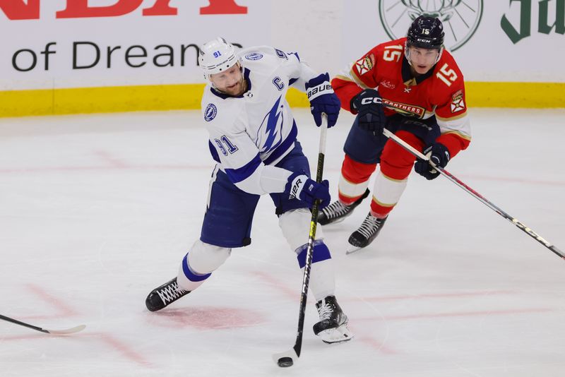 Apr 21, 2024; Sunrise, Florida, USA; Tampa Bay Lightning center Steven Stamkos (91) shoots the puck against the Florida Panthers during the third period in game one of the first round of the 2024 Stanley Cup Playoffs at Amerant Bank Arena. Mandatory Credit: Sam Navarro-USA TODAY Sports