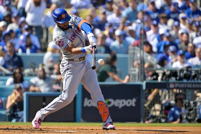 Oct 14, 2024; Los Angeles, California, USA; New York Mets outfielder Starling Marte (6) hits a single in the second inning against the Los Angeles Dodgers during game two of the NLCS for the 2024 MLB Playoffs at Dodger Stadium. Mandatory Credit: Jayne Kamin-Oncea-Imagn Images