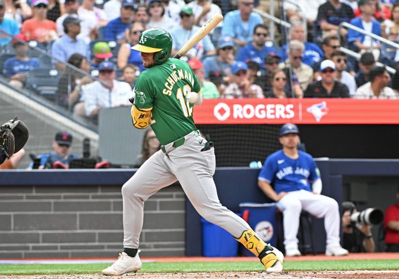 Aug 10, 2024; Toronto, Ontario, CAN; Oakland Athletics short stop Max Schuemann (12) is hit y a pitch in the fifth inning against the Toronto Blue Jays at Rogers Centre. Mandatory Credit: Gerry Angus-USA TODAY Sports