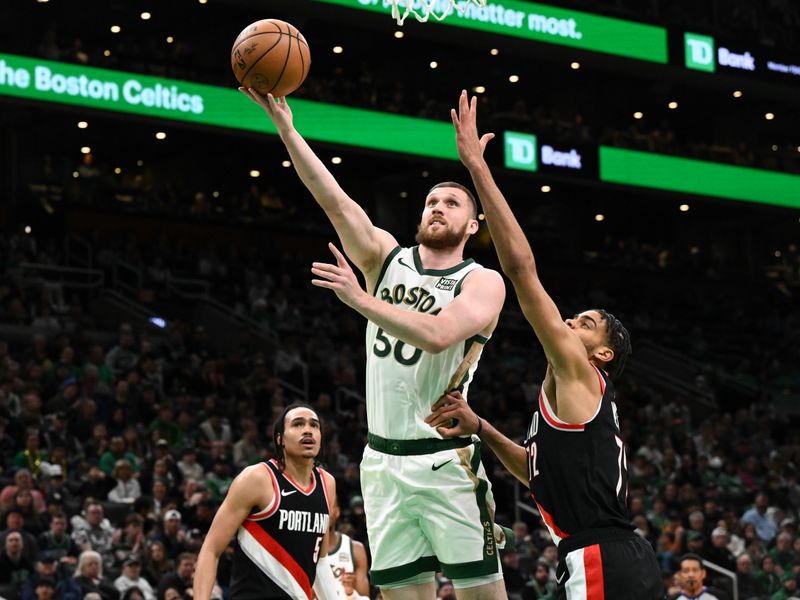 BOSTON, MASSACHUSETTS - APRIL 07: Svi Mykhailiuk #50 of the Boston Celtics attempts a layup against Rayan Rupert #72 of the Portland Trail Blazers during the fourth quarter at the TD Garden on April 07, 2024 in Boston, Massachusetts. NOTE TO USER: User expressly acknowledges and agrees that, by downloading and or using this photograph, User is consenting to the terms and conditions of the Getty Images License Agreement. (Photo by Brian Fluharty/Getty Images)