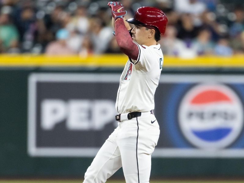 Apr 22, 2025; Phoenix, Arizona, USA; Arizona Diamondbacks outfielder Corbin Carroll celebrates after hitting a ground rule double in the third inning against the Tampa Bay Rays at Chase Field. Mandatory Credit: Mark J. Rebilas-Imagn Images
