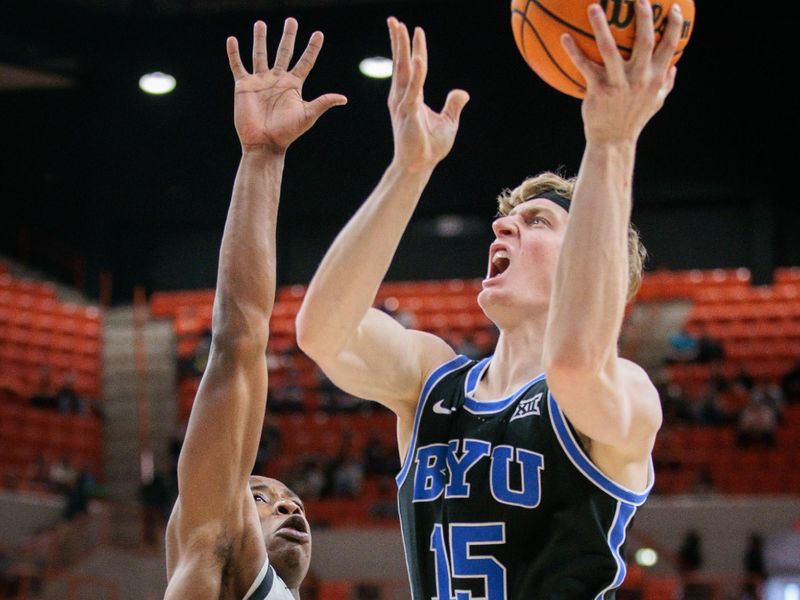 Feb 17, 2024; Stillwater, Oklahoma, USA; Brigham Young Cougars guard Richie Saunders (15) shoots the ball over Oklahoma State Cowboys guard Quion Williams (5) during the second half at Gallagher-Iba Arena. Mandatory Credit: William Purnell-USA TODAY Sports