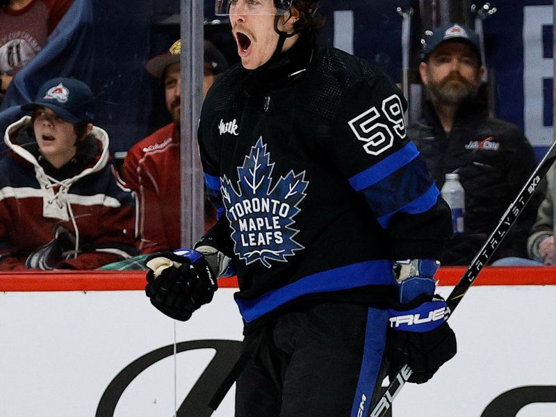 Feb 24, 2024; Denver, Colorado, USA; Toronto Maple Leafs left wing Tyler Bertuzzi (59) celebrates after his hat trick goal in the third period against the Colorado Avalanche at Ball Arena. Mandatory Credit: Isaiah J. Downing-USA TODAY Sports