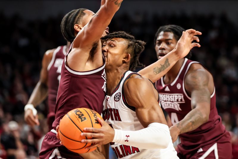 Jan 6, 2024; Columbia, South Carolina, USA; Mississippi State Bulldogs guard Shakeel Moore (3) fouls South Carolina Gamecocks guard Meechie Johnson (5) in the first half at Colonial Life Arena. Mandatory Credit: Jeff Blake-USA TODAY Sports