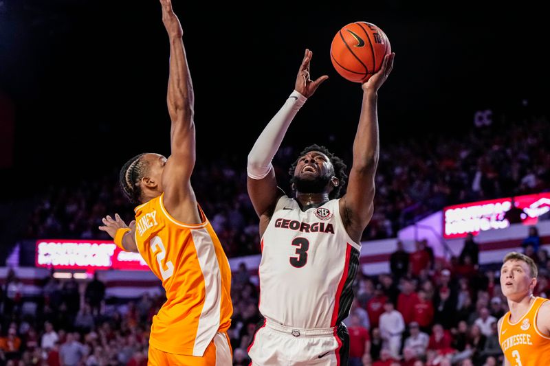 Jan 13, 2024; Athens, Georgia, USA; Georgia Bulldogs guard Noah Thomasson (3) shoots against Tennessee Volunteers guard Jordan Gainey (2) during the second half at Stegeman Coliseum. Mandatory Credit: Dale Zanine-USA TODAY Sports