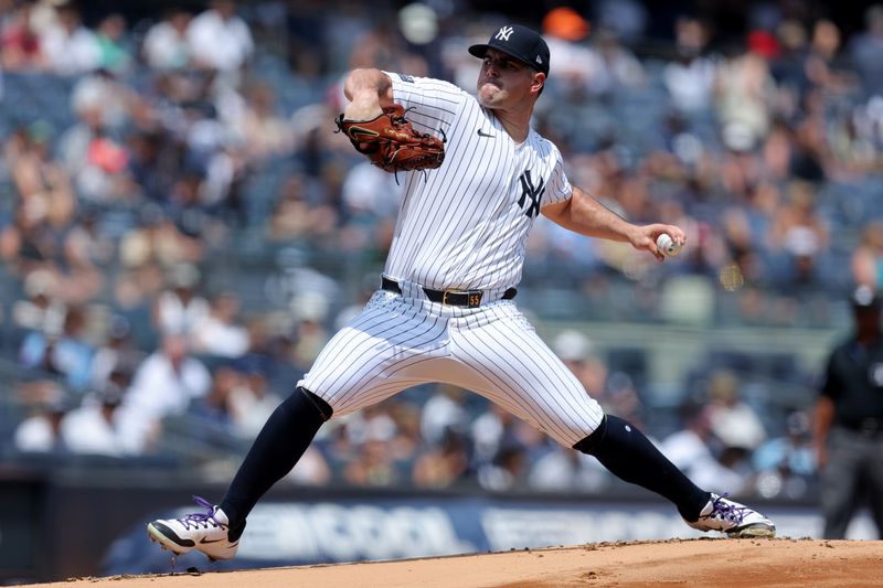 Aug 3, 2024; Bronx, New York, USA; New York Yankees starting pitcher Carlos Rodon (55) pitches against the Toronto Blue Jays during the first inning at Yankee Stadium. Mandatory Credit: Brad Penner-USA TODAY Sports