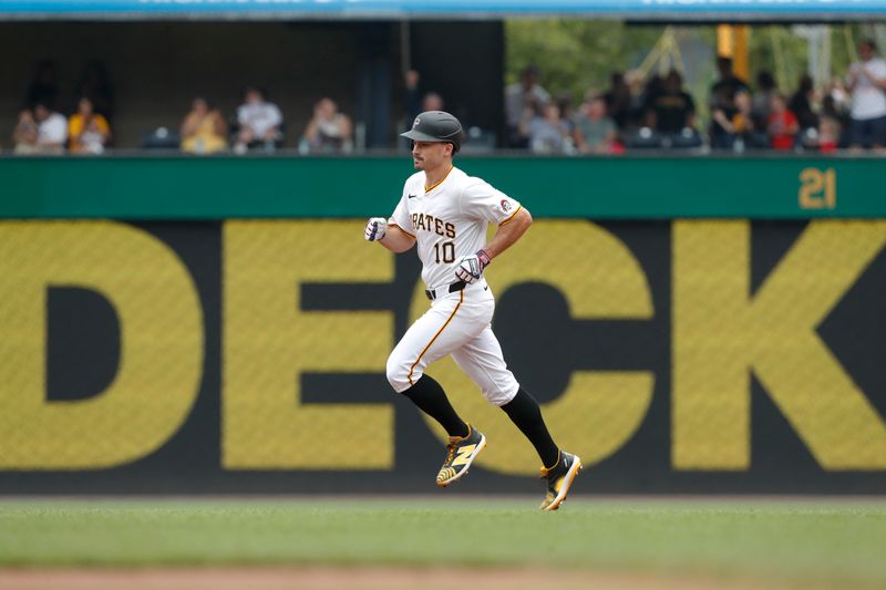 Jul 4, 2024; Pittsburgh, Pennsylvania, USA; Pittsburgh Pirates left fielder Bryan Reynolds (10) circles the bases on a solo home run against the St. Louis Cardinals during the fourth inning at PNC Park. Mandatory Credit: Charles LeClaire-USA TODAY Sports