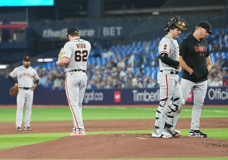 Jun 28, 2023; Toronto, Ontario, CAN; San Francisco Giants starting pitcher Logan Webb (62) gets ready to pitch against the Toronto Blue Jays during the first inning at Rogers Centre. Mandatory Credit: Nick Turchiaro-USA TODAY Sports