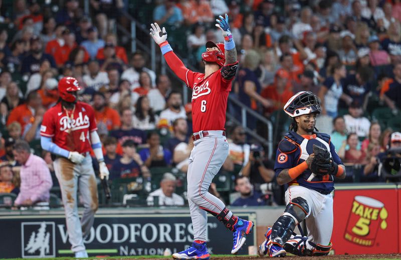 Jun 18, 2023; Houston, Texas, USA; Cincinnati Reds second baseman Jonathan India (6) crosses the plate past Houston Astros catcher Martin Maldonado (15) after hitting a home run during the eighth inning at Minute Maid Park. Mandatory Credit: Troy Taormina-USA TODAY Sports