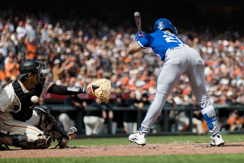 Apr 8, 2023; San Francisco, California, USA;  San Francisco Giants catcher Blake Sabol (2) misses a wild pitch to Kansas City Royals center fielder Kyle Isbel (28) that allowed the Royals to score during the ninth inning at Oracle Park. Mandatory Credit: John Hefti-USA TODAY Sports