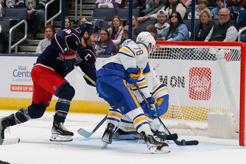 Feb 23, 2024; Columbus, Ohio, USA; Columbus Blue Jackets center Boone Jenner (38) reaches for the rebound of a Buffalo Sabres goalie Ukko-Pekka Luukkonen (1) save during the first period at Nationwide Arena. Mandatory Credit: Russell LaBounty-USA TODAY Sports