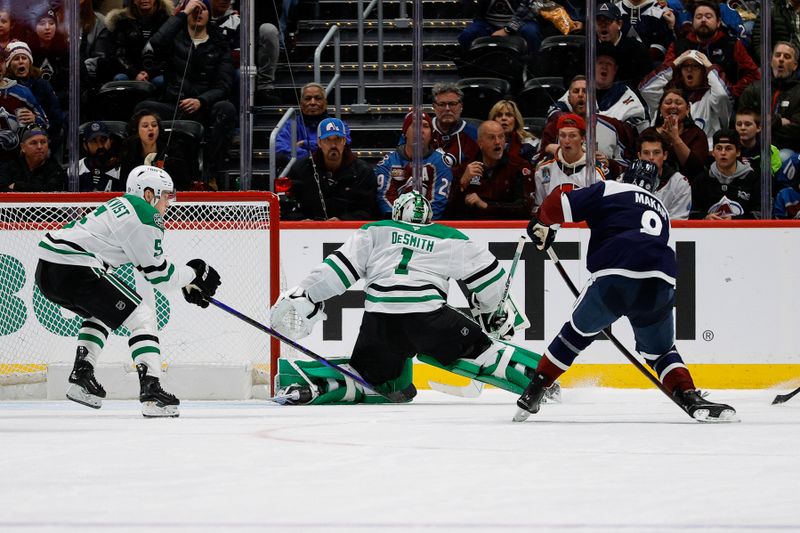 Jan 18, 2025; Denver, Colorado, USA; Colorado Avalanche defenseman Cale Makar (8) scores against Dallas Stars goaltender Casey DeSmith (1) as defenseman Nils Lundkvist (5) defends in the third period at Ball Arena. Mandatory Credit: Isaiah J. Downing-Imagn Images