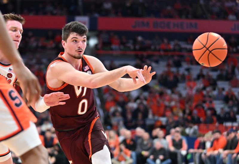 Feb 27, 2024; Syracuse, New York, USA; Virginia Tech Hokies guard Hunter Cattoor (0) passes the ball in the first half against the Syracuse Orange at the JMA Wireless Dome. Mandatory Credit: Mark Konezny-USA TODAY Sports