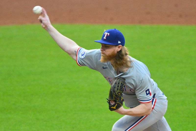 Aug 24, 2024; Cleveland, Ohio, USA; Texas Rangers starting pitcher Jon Gray (22) delivers a pitch in the first inning against the Cleveland Guardians at Progressive Field. Mandatory Credit: David Richard-USA TODAY Sports