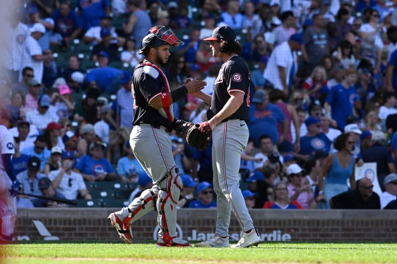 Sep 21, 2024; Chicago, Illinois, USA;  Washington Nationals pitcher Kyle Finnegan (67) reacts with catcher Keibert Ruiz (20) after a game against the Chicago Cubs at Wrigley Field. Mandatory Credit: Matt Marton-Imagn Images