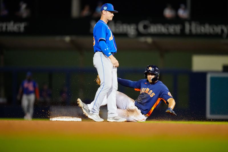 Mar 7, 2023; West Palm Beach, Florida, USA; Houston Astros outfielder Lorenzo Cedrola (97) slides into second base against the New York Mets during the seventh inning at The Ballpark of the Palm Beaches. Mandatory Credit: Rich Storry-USA TODAY Sports