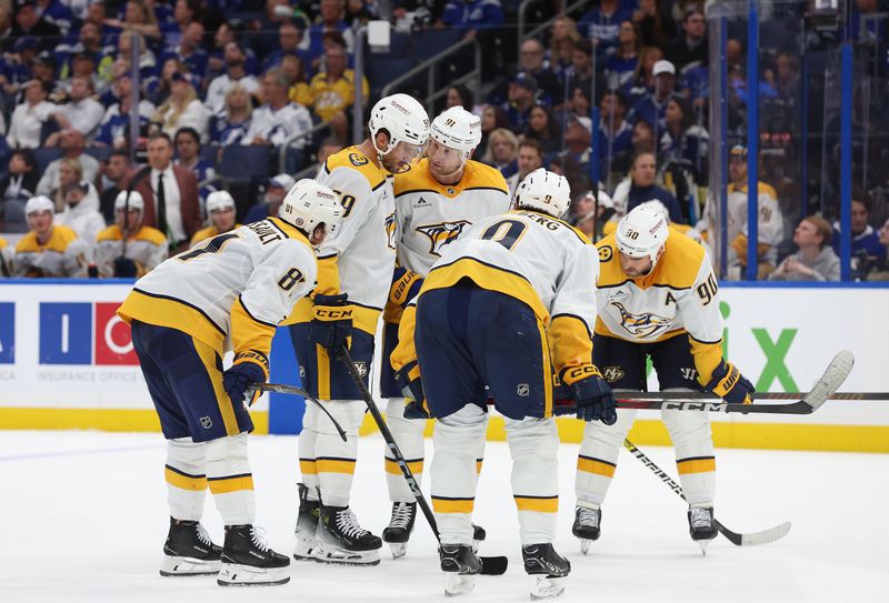 Oct 28, 2024; Tampa, Florida, USA; Nashville Predators center Steven Stamkos (91), defenseman Roman Josi (59), center Jonathan Marchessault (81), left wing Filip Forsberg (9) and center Ryan O'Reilly (90) talk during the second period against the Tampa Bay Lightning at Amalie Arena. Mandatory Credit: Kim Klement Neitzel-Imagn Images