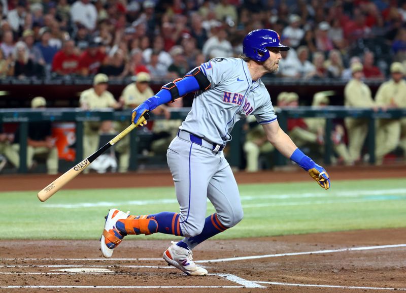 Aug 27, 2024; Phoenix, Arizona, USA; New York Mets infielder Jeff McNeil drives in a run in the second inning against the Arizona Diamondbacks at Chase Field. Mandatory Credit: Mark J. Rebilas-USA TODAY Sports