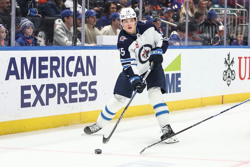 Mar 4, 2025; Elmont, New York, USA;  Winnipeg Jets center Rasmus Kupari (15) controls the puck in the first period against the New York Islanders at UBS Arena. Mandatory Credit: Wendell Cruz-Imagn Images