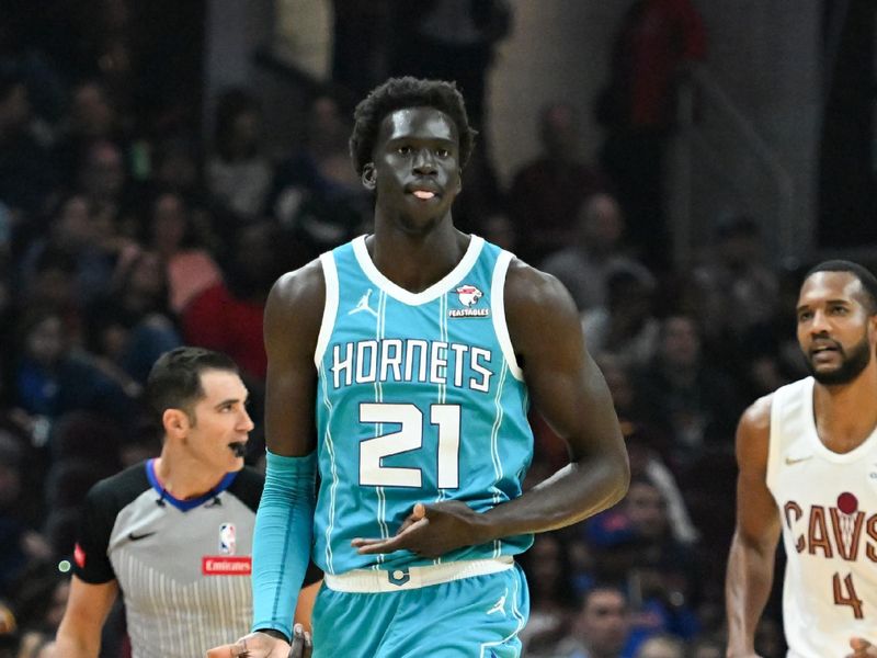 CLEVELAND, OHIO - APRIL 14: JT Thor #21 of the Charlotte Hornets celebrates making a three-point basket during the first half against the Cleveland Cavaliers at Rocket Mortgage Fieldhouse on April 14, 2024 in Cleveland, Ohio. NOTE TO USER: User expressly acknowledges and agrees that, by downloading and or using this photograph, User is consenting to the terms and conditions of the Getty Images License Agreement. (Photo by Nick Cammett/Getty Images)