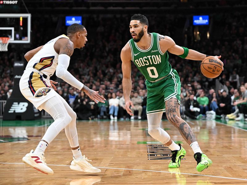 BOSTON, MASSACHUSETTS - JANUARY 12: Jayson Tatum #0 of the Boston Celtics drives to the basket against Dejounte Murray #5 of the New Orleans Pelicans during the first quarter at the TD Garden on January 12, 2025 in Boston, Massachusetts. NOTE TO USER: User expressly acknowledges and agrees that, by downloading and or using this photograph, User is consenting to the terms and conditions of the Getty Images License Agreement. (Photo by Brian Fluharty/Getty Images)