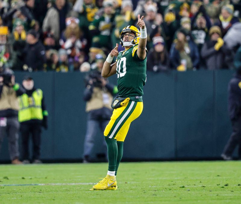 Green Bay Packers quarterback Jordan Love (10) reacts after throwing for a first down during the second half of an NFL football game against the Chicago Bears Sunday, Jan. 7, 2024, in Green Bay, Wis. (AP Photo/Jeffrey Phelps