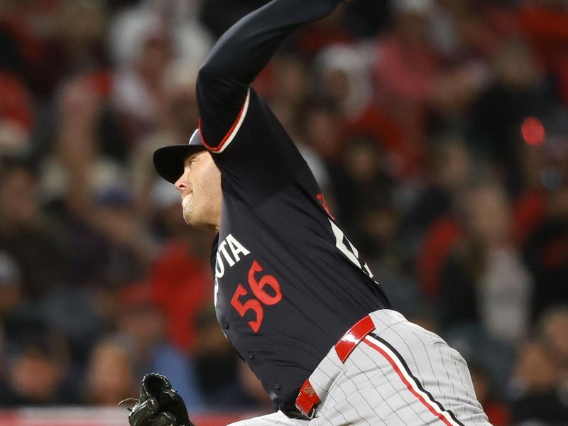 Apr 26, 2024; Anaheim, California, USA;  Minnesota Twins pitcher Caleb Thielbar (56) pitches during the ninth inning against the Los Angeles Angels at Angel Stadium. Mandatory Credit: Kiyoshi Mio-USA TODAY Sports