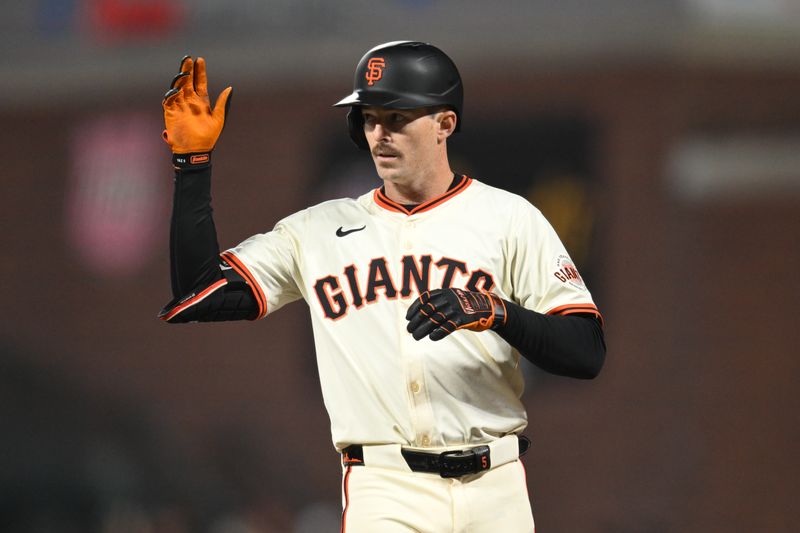 May 1, 2025; San Francisco, California, USA; San Francisco Giants right fielder Mike Yastrzemski (5) celebrates his single against the Colorado Rockies in the eighth inning at Oracle Park. Mandatory Credit: Eakin Howard-Imagn Images