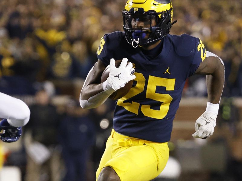 Nov 6, 2021; Ann Arbor, Michigan, USA; Michigan Wolverines running back Hassan Haskins (25) rushes in the first half against the Indiana Hoosiers  at Michigan Stadium. Mandatory Credit: Rick Osentoski-USA TODAY Sports