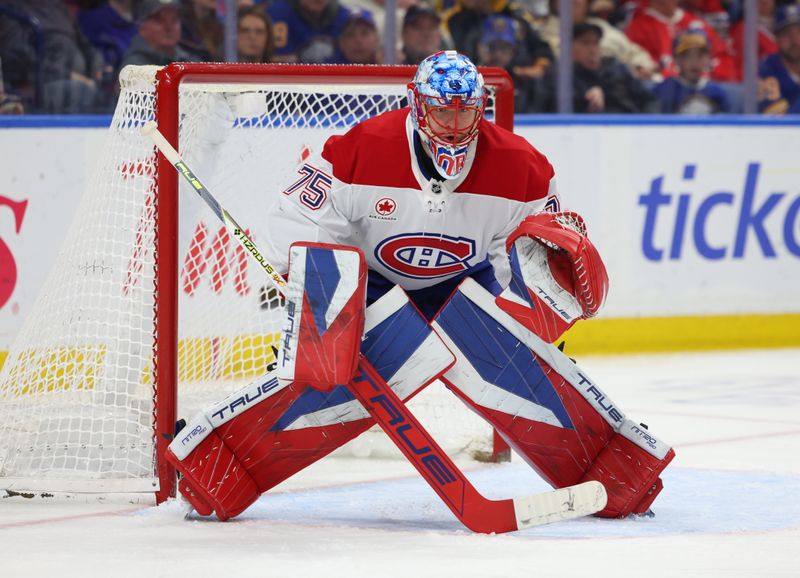 Jan 31, 2026; Buffalo, New York, USA;  Montréal Canadiens goaltender Jakub Dobes (75) looks for the puck during the second period against the Buffalo Sabres at KeyBank Center. Mandatory Credit: Timothy T. Ludwig-Imagn Images