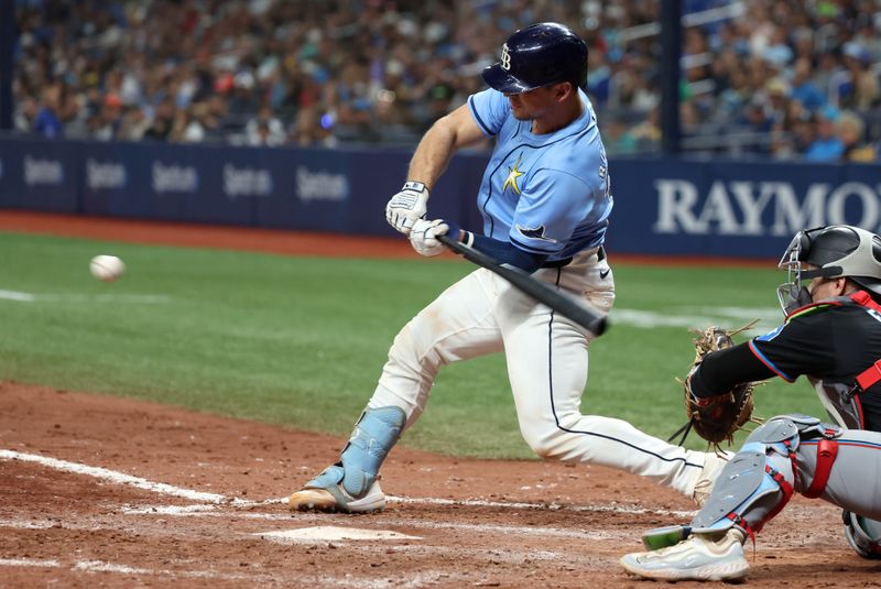 Jul 30, 2024; St. Petersburg, Florida, USA;  Tampa Bay Rays catcher Ben Rortvedt (30) hist a two-RBI single against the Miami Marlins during the sixth inning at Tropicana Field. Mandatory Credit: Kim Klement Neitzel-USA TODAY Sports