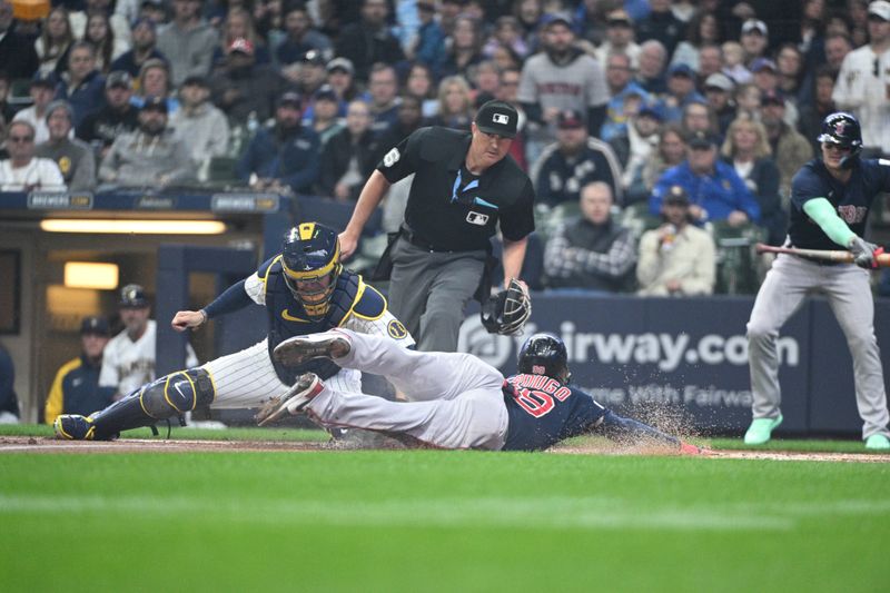 Apr 23, 2023; Milwaukee, Wisconsin, USA; Boston Red Sox right fielder Alex Verdugo (99) slide safely into home plate ahead of the tag from Milwaukee Brewers catcher Victor Caratini (7) at American Family Field. Mandatory Credit: Michael McLoone-USA TODAY Sports