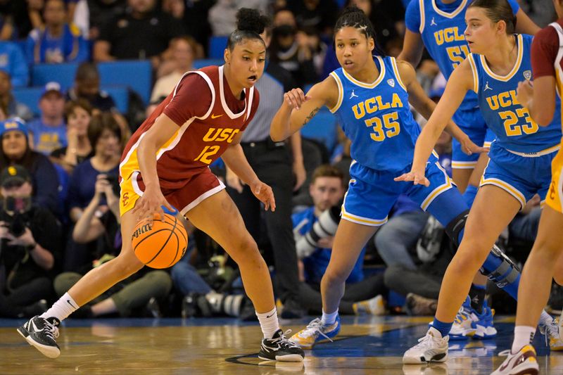 Dec 30, 2023; Los Angeles, California, USA; USC Trojans guard JuJu Watkins (12) is defended by UCLA Bruins guard Camryn Brown (35) in the first half at Pauley Pavilion presented by Wescom. Mandatory Credit: Jayne Kamin-Oncea-USA TODAY Sports