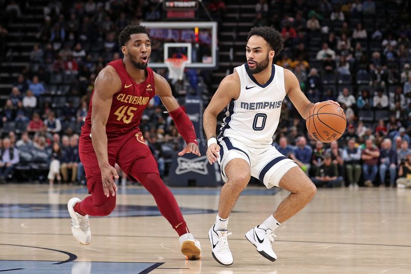 MEMPHIS, TENNESSEE - FEBRUARY 01: Jacob Gilyard #0 of the Memphis Grizzlies handles the ball against Donovan Mitchell #45 of the Cleveland Cavaliers during the second half at FedExForum on February 01, 2024 in Memphis, Tennessee. NOTE TO USER: User expressly acknowledges and agrees that, by downloading and or using this photograph, User is consenting to the terms and conditions of the Getty Images License Agreement. (Photo by Justin Ford/Getty Images)