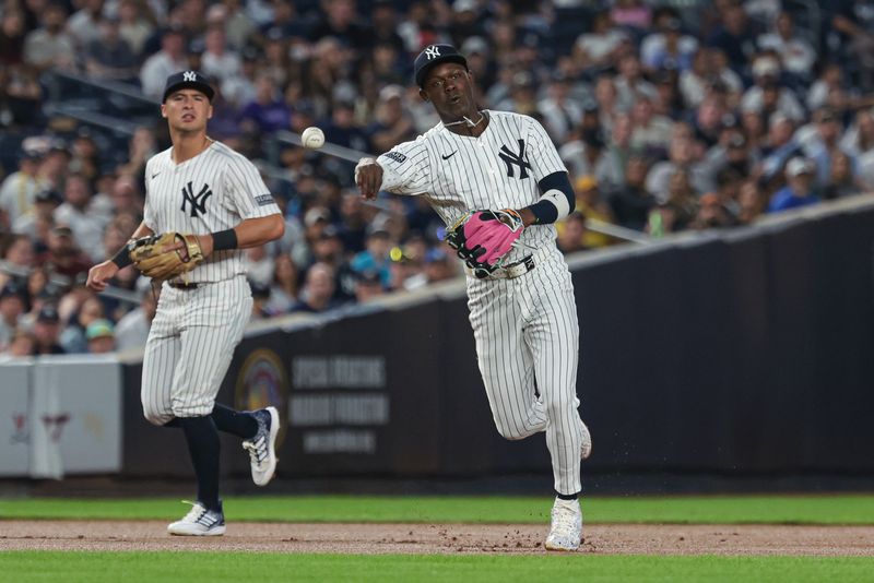 Aug 23, 2024; Bronx, New York, USA; New York Yankees third baseman Jazz Chisholm Jr. (13) throws the ball to first base for an out during the fourth inning against the Colorado Rockies at Yankee Stadium. Mandatory Credit: Vincent Carchietta-USA TODAY Sports