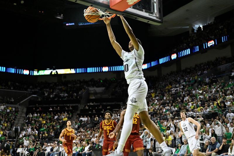 Mar 1, 2025; Eugene, Oregon, USA; Oregon Ducks forward Kwame Evans Jr. (10) dunks the ball against the USC Trojans during the first half at Matthew Knight Arena. Mandatory Credit: Craig Strobeck-Imagn Images