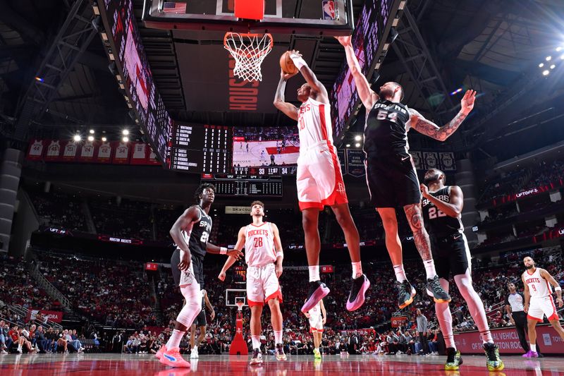 HOUSTON, TX - OCTOBER 17: Jabari Smith Jr. #10 of the Houston Rockets dunks the ball during the game against the San Antonio Spurs on October 17, 2024 at the Toyota Center in Houston, Texas. NOTE TO USER: User expressly acknowledges and agrees that, by downloading and or using this photograph, User is consenting to the terms and conditions of the Getty Images License Agreement. Mandatory Copyright Notice: Copyright 2024 NBAE (Photo by Logan Riely/NBAE via Getty Images)