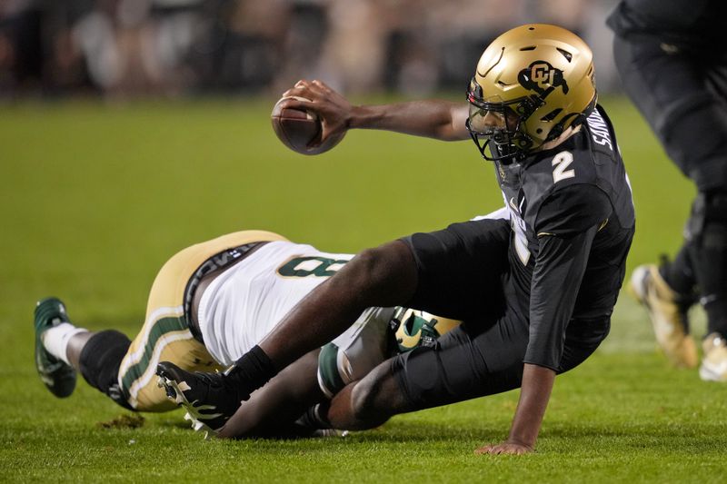 Sep 16, 2023; Boulder, Colorado, USA; Colorado State Rams defensive lineman Mohamed Kamara (8) sacks Colorado Buffaloes quarterback Shedeur Sanders (2) during the first half at Folsom Field. Mandatory Credit: Andrew Wevers-USA TODAY Sports