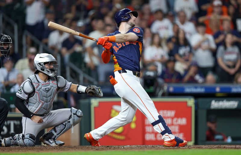 Sep 8, 2024; Houston, Texas, USA; Houston Astros designated hitter Kyle Tucker (30) drives in a run with a sacrifice fly during the fifth inning against the Arizona Diamondbacks at Minute Maid Park. Mandatory Credit: Troy Taormina-Imagn Images