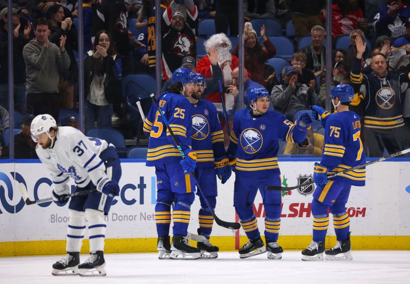 Dec 21, 2023; Buffalo, New York, USA;  Buffalo Sabres left wing Jeff Skinner (53) celebrates his goal with teammates during the third period against the Toronto Maple Leafs at KeyBank Center. Mandatory Credit: Timothy T. Ludwig-USA TODAY Sports