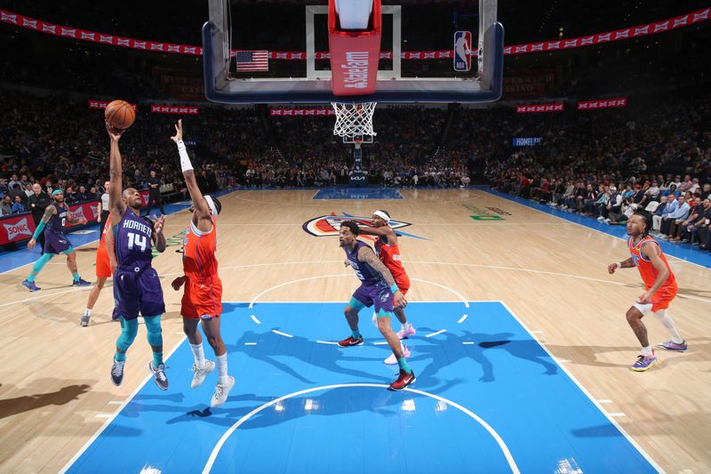 OKLAHOMA CITY, OK - FEBUARY 2:  Ish Smith #14 of the Charlotte Hornets goes to the basket during the game on February 2, 2024 at Paycom Arena in Oklahoma City, Oklahoma. NOTE TO USER: User expressly acknowledges and agrees that, by downloading and or using this photograph, User is consenting to the terms and conditions of the Getty Images License Agreement. Mandatory Copyright Notice: Copyright 2024 NBAE (Photo by Zach Beeker/NBAE via Getty Images)